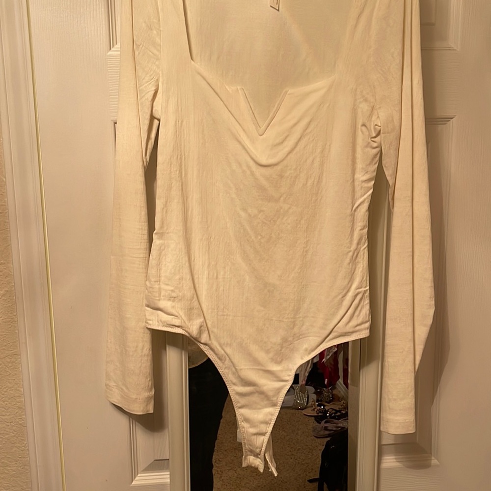 Free People Bodysuit - Never Worn. Beige with sexy V.